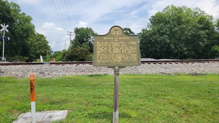 Georgia historical marker for the Battle of Resaca alongside the old rail line